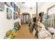 Artsy hallway adorned with art and mirrors, with unique lighting, and clean neutral carpet at 103 Se Tuscawilla Ave, Ocala, FL 34471