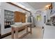 An eat-in kitchen with an island, stainless steel appliances, and a charming built-in display cabinet at 103 Se Tuscawilla Ave, Ocala, FL 34471