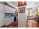 Cozy kitchenette features white cabinets, vintage decor, and hardwood floors at 103 Se Tuscawilla Ave, Ocala, FL 34471