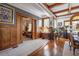 Elegant living room showing transition to the dining room, featuring beautiful woodwork and decor at 103 Se Tuscawilla Ave, Ocala, FL 34471