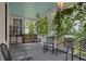 Inviting front porch features a swing, seating, and verdant vines, offering a tranquil outdoor retreat at 103 Se Tuscawilla Ave, Ocala, FL 34471