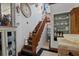 Unique staircase with a large clock and charming decorative elements on display at 103 Se Tuscawilla Ave, Ocala, FL 34471