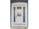 Elegant front door with decorative glass panels and white frame at 1264 Buckeye Ne Rd, Winter Haven, FL 33881
