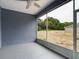 Screened-in patio of new home build offers shade and relaxing view of outdoor space at 1264 Buckeye Ne Rd, Winter Haven, FL 33881