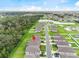 Overhead real estate view showcasing a neighborhood with green spaces, ponds, and well-maintained homes at 1274 Pintail Pl, Lakeland, FL 33813