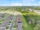 Desirable neighborhood with neatly arranged homes, solar panels, and serene landscaping near a pond at 1274 Pintail Pl, Lakeland, FL 33813