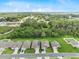 Real estate aerial view showing home location within a neighborhood with green spaces and a pond at 1274 Pintail Pl, Lakeland, FL 33813