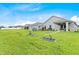 Expansive backyard featuring well-maintained lawn and play area at 1274 Pintail Pl, Lakeland, FL 33813