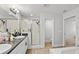 Bathroom with a glass-enclosed shower and double vanity at 1274 Pintail Pl, Lakeland, FL 33813