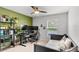 Bright bedroom featuring neutral walls, ceiling fan, large window, and space for desk and bed at 1274 Pintail Pl, Lakeland, FL 33813