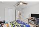Bedroom featuring neutral walls, ceiling fan, closet, and access to bathroom at 1274 Pintail Pl, Lakeland, FL 33813