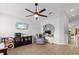 Bedroom featuring a ceiling fan, wood-look floors, and modern decor at 1274 Pintail Pl, Lakeland, FL 33813