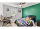 Bright bedroom featuring neutral walls, ceiling fan, and large window at 1274 Pintail Pl, Lakeland, FL 33813