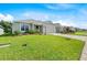 Well-kept home featuring a green lawn, tidy landscaping, and an attached two-car garage at 1274 Pintail Pl, Lakeland, FL 33813