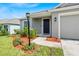 Close-up of home's front door with tidy landscaping and a walkway at 1274 Pintail Pl, Lakeland, FL 33813