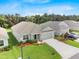 Charming single-Gathering home displaying verdant lawn, tidy shrubbery, and a concrete driveway at 1274 Pintail Pl, Lakeland, FL 33813