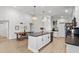 Bright kitchen with an island, modern appliances, and stylish pendant lighting at 1274 Pintail Pl, Lakeland, FL 33813