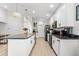 Bright, modern kitchen with sleek black appliances, and a center island at 1274 Pintail Pl, Lakeland, FL 33813