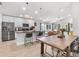 Spacious kitchen featuring an island with seating, open to the dining and living area at 1274 Pintail Pl, Lakeland, FL 33813
