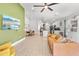 Open-concept living room, showcasing a seamless flow to the kitchen and dining area at 1274 Pintail Pl, Lakeland, FL 33813