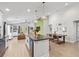 Open floorplan featuring a kitchen island, dining area, and cozy living space at 1274 Pintail Pl, Lakeland, FL 33813