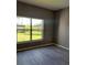 View from the bedroom window of the private backyard and water feature with modern wood flooring at 130 Prima Dr, Kissimmee, FL 34759