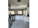 Modern kitchen featuring stainless steel appliances and sleek white cabinetry at 130 Prima Dr, Kissimmee, FL 34759