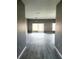 Spacious living area featuring sliding glass doors and neutral color scheme at 130 Prima Dr, Kissimmee, FL 34759