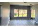 Living room with views from windows and sliding doors to the exterior at 130 Prima Dr, Kissimmee, FL 34759
