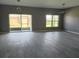 Bright living room with sliding doors and windows offering views of the surrounding yard at 130 Prima Dr, Kissimmee, FL 34759