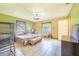 The bedroom features tile floors, two windows, and includes a pet cage at 1317 Avenue A Se, Winter Haven, FL 33880