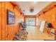 Spacious bonus room with wood paneling and sliding doors to the outdoors at 1317 Avenue A Se, Winter Haven, FL 33880