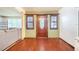 Beautiful wooden front door with side windows and wood flooring at 1317 Avenue A Se, Winter Haven, FL 33880