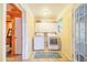 Convenient laundry room with washer, dryer, and ample storage cabinets at 1317 Avenue A Se, Winter Haven, FL 33880
