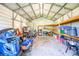 The inside of the shed reveals ample storage space and shelving at 1317 Avenue A Se, Winter Haven, FL 33880