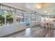 Inviting sunroom with many windows, a dining area, and views of the pool at 1317 Avenue A Se, Winter Haven, FL 33880