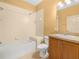 Bathroom with tub/shower combo and wooden vanity at 1349 Innsbruck Ct, Winter Haven, FL 33884