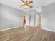 Spacious bedroom features wood-look tile flooring and neutral paint, perfect for a serene retreat at 1349 Innsbruck Ct, Winter Haven, FL 33884