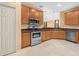 The dining room offers natural light, laminate flooring and decorative hanging light fixture at 1349 Innsbruck Ct, Winter Haven, FL 33884