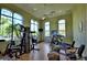 Bright community gym with large windows and various exercise machines including treadmills, bikes and free weights at 1349 Innsbruck Ct, Winter Haven, FL 33884