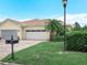 Charming single-Gathering home featuring a well-maintained lawn, landscaping and a brick paver driveway at 1349 Innsbruck Ct, Winter Haven, FL 33884