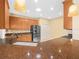 Modern kitchen featuring granite countertops, stainless steel appliances, and ample cabinet space at 1349 Innsbruck Ct, Winter Haven, FL 33884