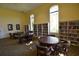Library space with ample seating and extensive built-in bookshelves at 1349 Innsbruck Ct, Winter Haven, FL 33884