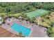 Aerial view showcasing a sparkling pool, hot tub, and verdant landscaping at 1349 Innsbruck Ct, Winter Haven, FL 33884