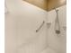 Shower with grab bar and tile surround at 1349 Innsbruck Ct, Winter Haven, FL 33884