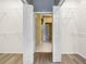 Large walk-in closet with shelving that leads into the bathroom at 1349 Innsbruck Ct, Winter Haven, FL 33884