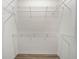 Walk-in closet with white walls and wire shelving provides ample storage at 1349 Innsbruck Ct, Winter Haven, FL 33884
