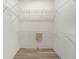 Walk-in closet with neutral paint and wire shelving at 1349 Innsbruck Ct, Winter Haven, FL 33884