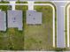 Aerial view of a home with a large backyard, showcasing the roof and surrounding neighborhood at 137 Piave St, Haines City, FL 33844