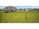 Large, grassy backyard offers ample space and is ready for outdoor activities and landscaping at 137 Piave St, Haines City, FL 33844